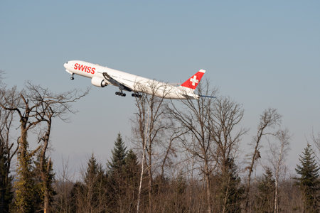 Zurich, Switzerland, February 10, 2022 Swiss International Airlines Boeing 777-300ER airplane is departing from runway 28 at the international airportのeditorial素材