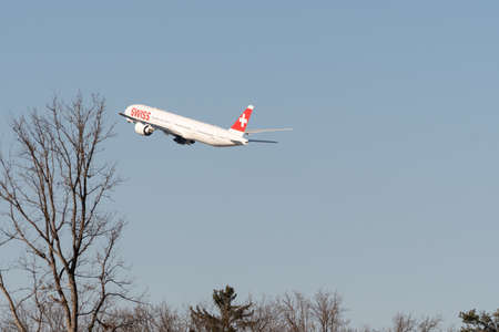 Zurich, Switzerland, February 10, 2022 Swiss International Airlines Boeing 777-300ER airplane is departing from runway 28 at the international airportのeditorial素材