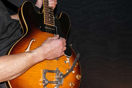 Vaduz, Liechtenstein, January 28, 2022 Musician is performing with a Gibson ES-330 made in USA in...