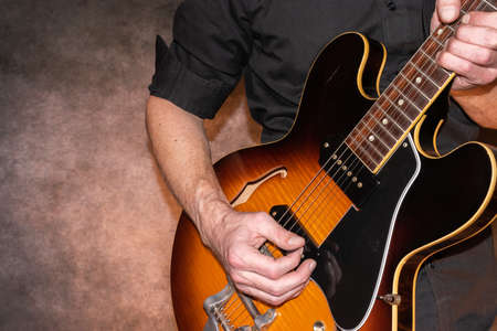 Vaduz, Liechtenstein, January 28, 2022 Musician is performing with a Gibson ES-330 made in USA in...