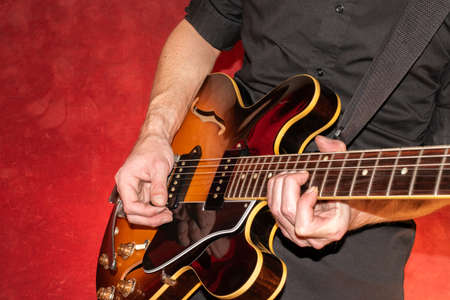 Vaduz, Liechtenstein, January 28, 2022 Musician is performing with a Gibson ES-330 made in USA in sunburstのeditorial素材