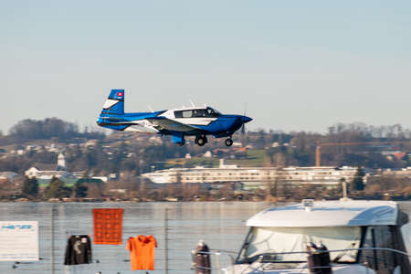 Wangen-Lachen, Switzerland, February 13, 2022 Mooney M20 aircraft approaching a small airfieldのeditorial素材