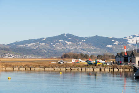 Wangen-Lachen, Switzerland, February 13, 2022 View over the lake of Zurich to the small airfield on a sunny dayのeditorial素材