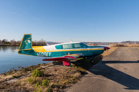 Wangen-Lachen, Switzerland, February 13, 2022 Mooney M20 propeller plane is exhibited on a small...