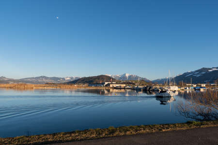 Wangen-Lachen, Switzerland, February 13, 2022 View over the lake of Zurich to the small airfield on a sunny dayのeditorial素材