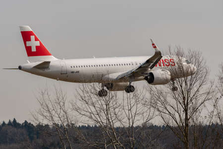 Zurich, Switzerland, February 24, 2022 Swiss International Airlines Airbus A320-271N aircraft final approach on runway 14のeditorial素材