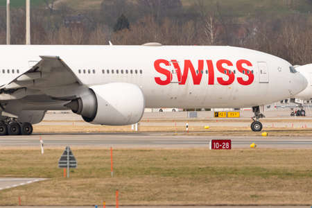Zurich, Switzerland, February 24, 2022 Swiss International Airlines Boeing 777-300ER is taxiing to...