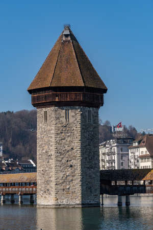 Lucerne, Switzerland, March 10, 2022 Tower of the popular old chapel bridge and most interesting landmark in the city centerのeditorial素材