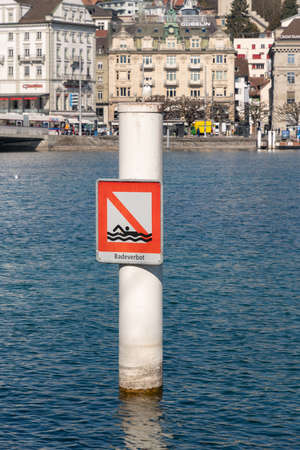 Lucerne, Switzerland, March 10, 2022 Swimming prohibited sign at the bay of the lake of Lucerne in the city centerのeditorial素材