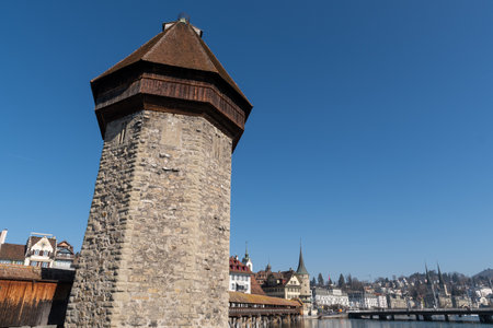 Lucerne, Switzerland, March 10, 2022 Tower of the popular old chapel bridge and most interesting landmark in the city centerのeditorial素材