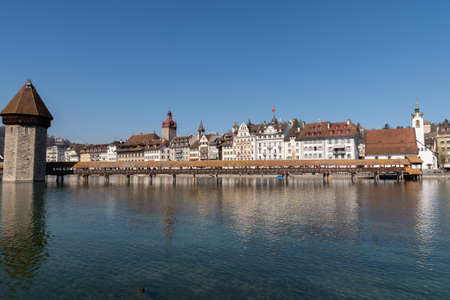 Lucerne, Switzerland, March 10, 2022 Beautiful promenade with historic buildings at the lake of Lucerne on a sunny dayのeditorial素材