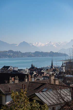 Lucerne, Switzerland, March 10, 2022 View over the lake and the city with the beautiful alps in the...