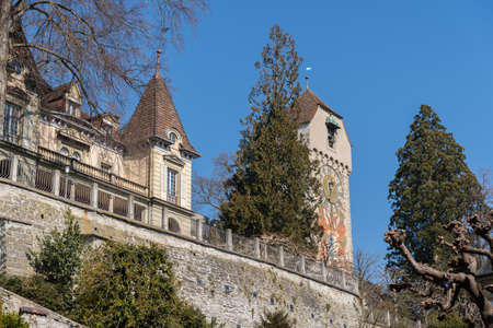 Lucerne, Switzerland, March 10, 2022 Historic old tower in a pretty park at the Musegg walls on a sunny dayのeditorial素材