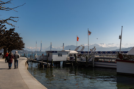 Lucerne, Switzerland, March 10, 2022 Water promenade at the beautiful lake on a sunny day
