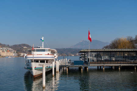 Lucerne, Switzerland, March 10, 2022 Little ship on the lake on a sunny day
