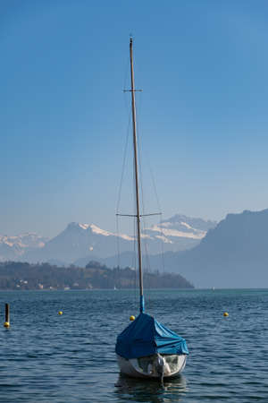 Lucerne, Switzerland, March 10, 2022 Little ship on the lake on a sunny dayの写真素材