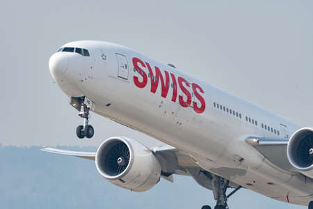 Zurich, Switzerland, March 2, 2022 Swiss International Airlines Boeing 777-300ER is taking off from...