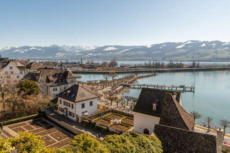 Rapperswil, Switzerland February 27, 2022 View over the city and the lake of Zurich with the alps in the backgroundのeditorial素材