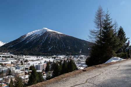 Davos, Switzerland, March 23, 2022 View over the city and the fascinating snow covered alps on a...