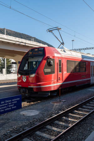 Davos, Switzerland, March 23, 2022 Local train at the main station in the city center on a sunny day