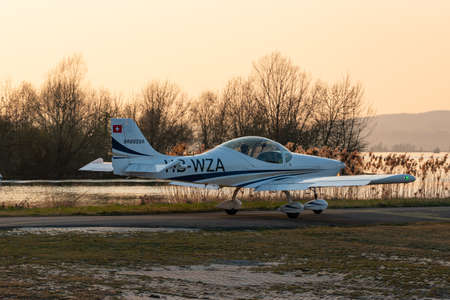 Wangen-Lachen, Switzerland, March 27, 2022 Breezer B600 propeller plane in the evening on a small...