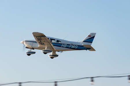Wangen-Lachen, Switzerland, March 27, 2022 Piper PA28-181 Archer II propeller plane take off from a...