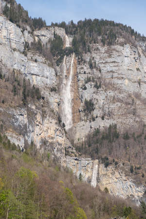Weesen, Switzerland, April 13, 2022 Impressive waterfall in the alpine mountainsの写真素材
