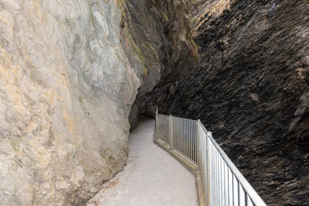 Zillis, Grison, Switzerland, April 12, 2022 Tight pedestrian way leads through the massive alps at the Viamala canyonの写真素材