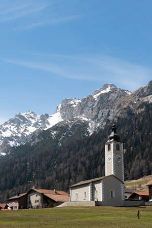 Sufers, Grison, Switzerland, April 12, 2022 Catholic church in a lovely alpine scenery on a sunny...