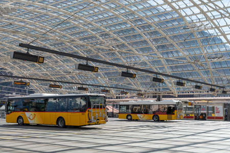 Chur, Switzerland, April 11, 2022 Local buses are parking at the main station in the city center