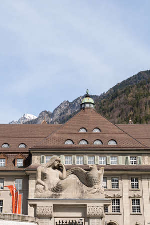 Chur, Switzerland, April 11, 2022 Statue in front of a building in the city center on a sunny dayのeditorial素材