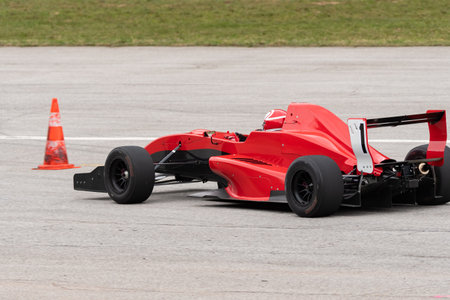 Ambri, Ticino, Switzerland, April 3, 2022 Car test racing along the runway on the local airfield