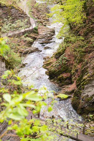 Unterwasser, Switzerland, May 5, 2022 Little alpine river flows along a canyon at the Thur...