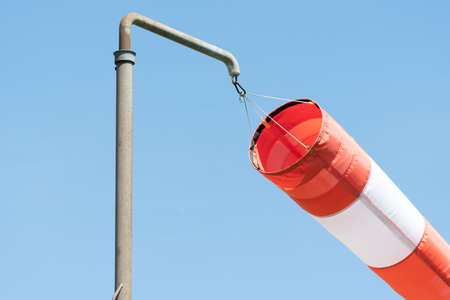 Lommis, Switzerland, May 11, 2022 Windsock is waving in the wind at a small airfieldの写真素材