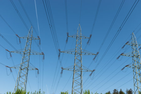Switzerland, May 11, 2022 High voltage power pole stations on a sunny day