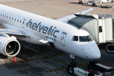 Zurich, Switzerland, January 19, 2023 Helvetic airways Embraer E-190-E2 aircraft is parking at the...