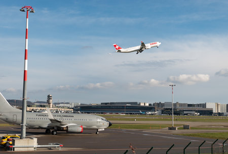 Zurich, Switzerland, January 19, 2023 Swiss Airbus A330-343 is taking off behind a colombian 737-700 government aircraft which is parked during the world economic forumのeditorial素材