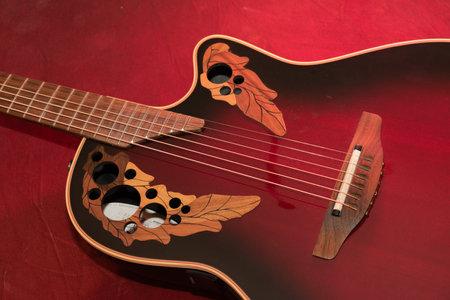 Vaduz, Liechtenstein, January 13, 2023 Product shot of an Ovation acoustic guitar in redのeditorial素材