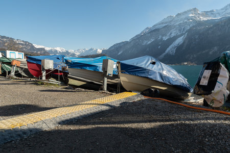 Brienz, Switzerland, February 10, 2023 Little boats are covered and stored at the coast of the lake of Brienzのeditorial素材