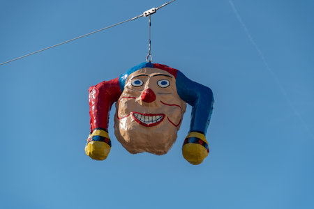 Oberaegeri, Switzerland, February 20, 2023 Clown head is hanging on a rope during carnivalのeditorial素材