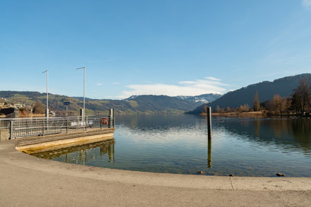 Unteraegeri, Switzerland, February 20, 2023 Boat pier at the coast of the lake Aegeriseeのeditorial素材