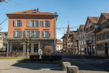 Unteraegeri, Switzerland, February 20, 2023 Historic old buildings in the city center on a sunny dayのeditorial素材