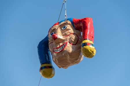 Oberaegeri, Switzerland, February 20, 2023 Clown head is hanging on a rope during carnivalのeditorial素材