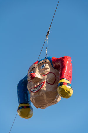 Oberaegeri, Switzerland, February 20, 2023 Clown head is hanging on a rope during carnivalのeditorial素材