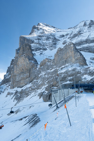 Eigergletscher, Canton Bern, Switzerland, February 11, 2023 Massive mountain formation covered with snow on a sunny dayのeditorial素材