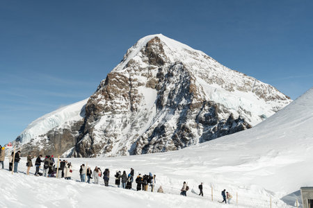 Jungfraujoch, Canton Bern, Switzerland, February 11, 2023 Many people are visiting the top on a sunny winter dayのeditorial素材