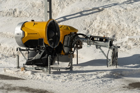 Kleine Scheidegg, Canton Bern, Switzerland, February 11, 2023 Snow canon is parked at the edge in the winter timeのeditorial素材