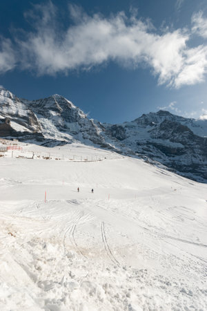 Breathtaking alpine mountain panorama on a sunny winter dayの写真素材
