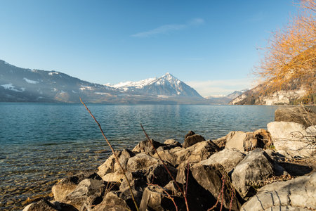 Beatenberg, Canton Bern, Switzerland, February 12, 2023 Fascinating view over the lake of Thun and the mount Niesen in the background on a sunny dayの写真素材