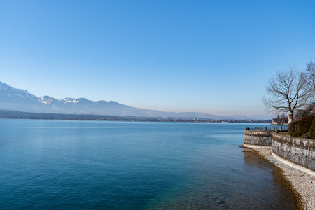Lovely view over the lake of Thun and an alpine scenery on a sunny day
